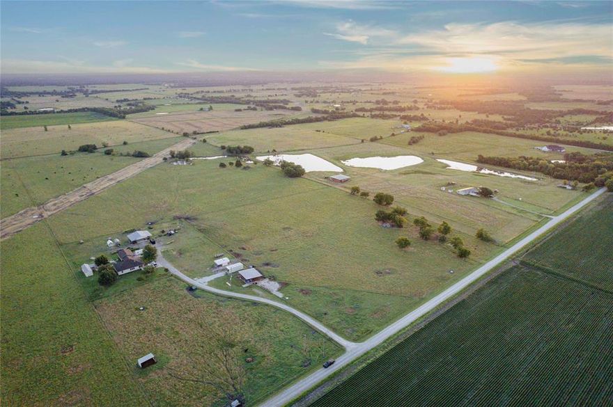 41-acre hobby farm located in Wolfe City with approximately 850 feet of county road frontage. Property is fenced and cross-fenced, includes a pond, and is well-suited for livestock, hay production, or continued hobby farm use. AG exemption is in place.
Improvements include:
1,776± sq ft single-story home with 3 bedrooms, 2 full bathrooms, eat-in kitchen, formal living room, and office or den
588± sq ft guest house (built in 2020) with open floor plan, full bath, HVAC, water, septic, and electricity
966± sq ft detached two-car garage
1,840± sq ft pole barn with 600± sq ft with attached carport
1,200± sq ft equipment barn
Large chicken coop
Livestock handling equipment
Double indoor and outdoor dog kennel
Greenhouse
Utilities on site include co-op water, electricity, aerobic septic, and propane. An additional 25± contiguous acres with two ponds and county road access available for purchase. Located 1.3 miles from Hwy 11, 4 miles from Wolfe City, and within 30 minutes of Bois D’Arc Lake, the future Lake Ralph Hall, and Webb Hill Country Club.

Seller is open to Owner Financing