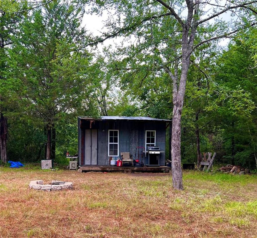 Thirty five plus acres of beautiful, ready to hunt, land. There are plenty of trails cleared and easy to navigate. Also, the property features several clearings for feeders and stands. This property also has a storage shed (hunting cabin) with corrugated steel siding, plank flooring, and white indoor paneling. The building is wired for lights. New air conditioning wall unit will convey. This is a lovely secluded country site to build your dream home! A 35 minute drive to Waco. One hour from College Station. Thirty minute drive to Limestone Lake or Fort Parker Lake.