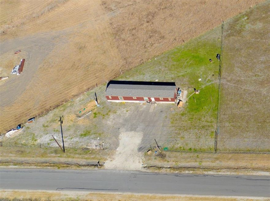 1.58 cleared acres of Prime land location, 30 minutes from downtown Dallas, no restrictions great to build your dream home or to bring a double-wide mobile home. Septic, sewer and electricity connected on property, don't let pass this great opportunity. Current lease ends in November 2025, manufactured home belongs to tenant, please do not disturb tenants. Seller financing available see private notes for terms or call listing agent.