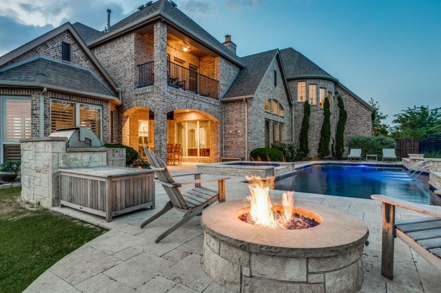 LAKEFRONT-GOLF COURSE LOT on cul de sac in the prestigious gated community of Balmerino in The Tribute. This home is a showstopper with its amenities and its prime location; just steps away from the waters edge so grab your kayak! Featuring Vaulted Cedar Beamed Ceilings in Family room and Owner retreat, furniture style cabinetry, stone countertops, en-suite off every bedroom with walk in closets, SS appliances, 6 burner gas-vented cooktop, double ovens, built in desk, large utility room with sink, built ins, counter, butlers pantry, full Bar in game room with sink and mini frig, Stone gas fireplace, 2nd floor balcony with amazing views, Media room with 122 inch Screen. The expansive formal dining features, detailed woodwork. The backyard is the perfect oasis, heated pool, spa, outdoor kitchen with grill and mini frig, stone fire pit, travertine decking, oversized covered patio with tv! Enjoy resort style amenities including a  pickle ball court, pools, hike & bike trails and more!