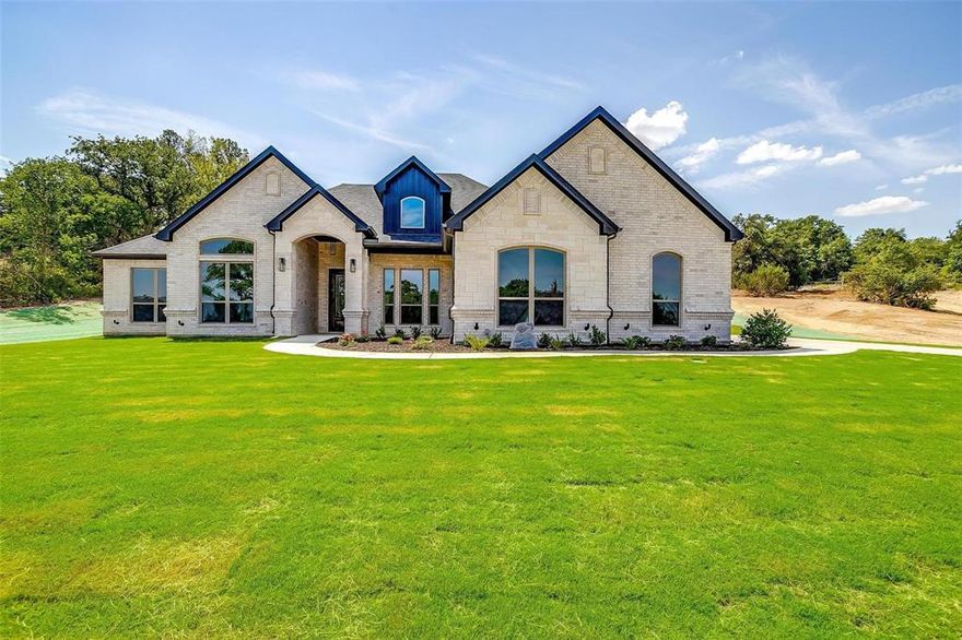 This expertly crafted home blends refined finishes with the tranquility of country living. This stunning residence offers 4 spacious bedrooms, 3 full bathrooms, a dedicated office, and an oversized 3-car garage.

Step inside to find beautiful hard wood flooring flowing seamlessly through the foyer, office, main living areas, kitchen, and bathrooms, creating both durability and sophistication. The heart of the home is a thoughtfully designed kitchen featuring granite countertops, classic subway tile backsplash, and premium Whirlpool stainless steel appliances perfect for both everyday living and entertaining. Bonus, Kitchen is plumbed for gas

The expansive living room impresses with vaulted ceilings, striking knotty alder beams, and a floor-to-ceiling stone fireplace that serves as a dramatic focal point. The private primary suite offers a true retreat, complete with dual vanities, quartz countertops, a large walk in shower, and a freestanding soaking tub.

Built with energy efficiency in mind, the home includes foam insulation to help maintain comfort while keeping utility costs low. Situated in a peaceful, country-style setting with no HOA restrictions, this property provides the perfect balance of privacy, space, and convenience.

This is a rare opportunity to own a beautifully finished home in an exceptional location with NO HOA!