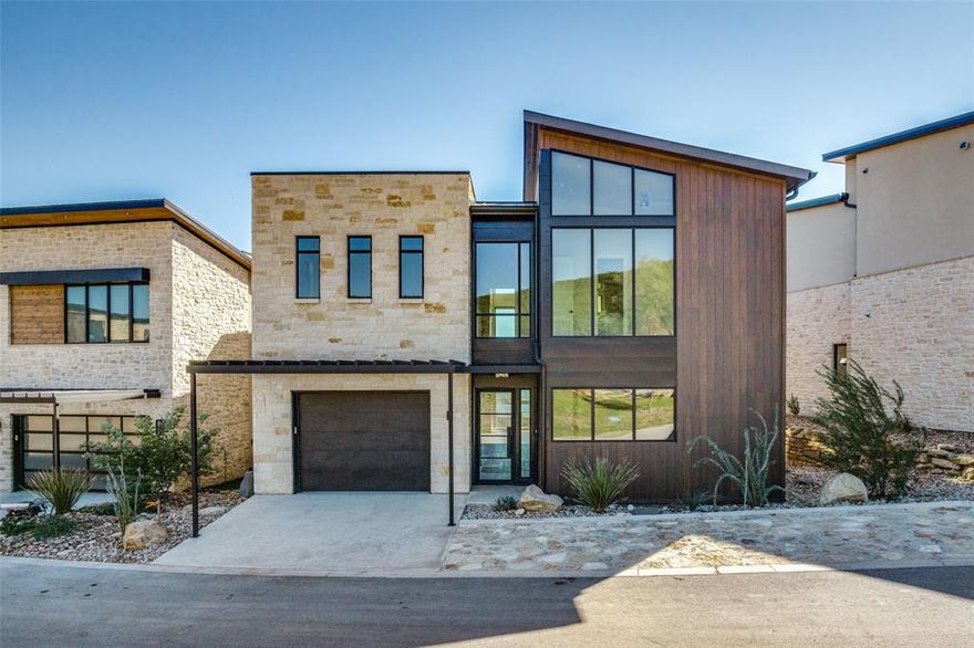 Stunning new construction located in the prestigious Juniper Ridge Community on Possum Kingdom Lake.  Amazing views await throughout the light and open floor plan in this dream home. The chef's kitchen highlighted by quartz counters, subway tile backsplash, huge island, Monogram stainless appliances and tons of cabinets and counter space overlooks the large living area with stacked stone fireplace and dining area. All 4 bedrooms each have their own full bath with 1 bedroom down and 3 bedrooms upstairs. Gorgeous primary bath with his & her sinks, massive walk in shower, soaking tub and an incredible walk in closet. Residents can enjoy an array of resort-style amenities including a community pool, a marina with guest slips and rental boats, and a lush putting green. The property also boasts a vibrant activity lawn area, perfect for outdoor enjoyment. Adding to it is the unique bunker area, complete with a covered community cabana. This social hub is enhanced by a cozy fire pit, large screen TVs, restrooms, and grills, creating an ideal space for gatherings and relaxation. More information on Juniper Ridge located at www.jr-pk.life