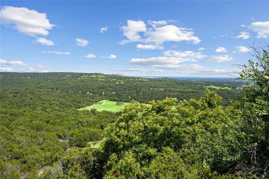 This 1,533 acre turnkey ranch offers a perfect blend of rugged beauty, wildlife, and modern amenities, with elevations reaching 1,929 feet—the highest point in Comanche County. The 2,880 SF, 5-bedroom, 2-bath home is ideal for hosting guests, while 8 ponds, 3 water wells, and abundant wildlife, including whitetail deer, turkey, and migratory birds, make it a hunter’s paradise. Fully fenced for cattle with a carrying capacity of 80 animal units, the property features diverse terrain, from fertile bottomland with a wet weather creek to scenic hilltops with sweeping views. One standout feature of the ranch is a rock outcropping with carvings from early settlers.  Native American artifacts can be found walking along the creek and around the rock outcroppings on the property. Improvements include a metal storage building, party barn, walk in freezer and cattle pens, with hunting blinds and feeders strategically placed for an optimal experience. Ready for ranching, recreation, and year-round enjoyment, this property offers unmatched versatility.