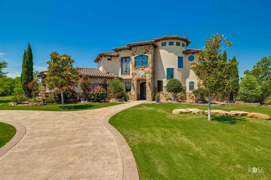 Rare West Texas luxury: this custom-designed 4,971 SF, 4-bed, 4.5-bath home showcases exceptional craftsmanship with high-end finishes and unique features. The residence boasts a formal living room with a gas fireplace, a family room with a wood-burning fireplace, a wine room, two game rooms, two laundry rooms, and an office. Mixed flooring—marble, wood, tile, and carpet—enhances a marble-adorned bath. The master suite offers private laundry, dual closets, a gas fireplace, and a spa-like bath with a marble shower (rain head & dual sprays), accent wall, and makeup vanity. The custom kitchen dazzles with double ovens, warming drawer, spice pull-outs, RO system, soft-close drawers & cabinets, pot filler, deep drawers, tray storage, and butler pantry. Outdoors, enjoy a pool with an outdoor kitchen, pergola-covered fire pit, putting green, turf, two 40x60 barns (one with a 900 sf apt featuring 2 beds, 2 baths and bunk beds), and RV cover with 50 amp hookup.