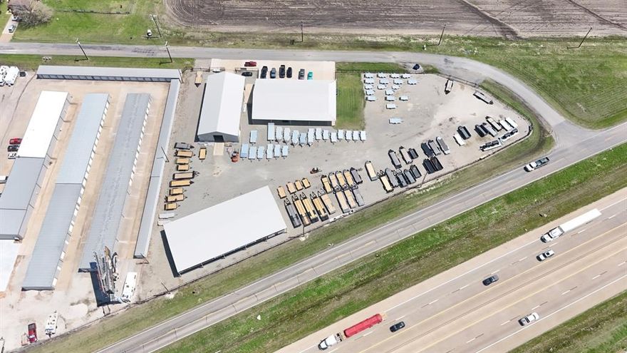 Highly visible, very high quality property with Hwy 75 frontage on one side, paved road frontage on the other side. Easy access in all directions. Completely fenced in lot. Main showroom, office has approximately 7500sf, including showroom, offices, and quarters with high ceilings. Service building has approximate 5000 sf with multiple roll up and overhead doors as well as drive throughs. Clear height to accommodate large vehicles. Canopy is approximately 7500 sf. Lots of surface parking for vehicles, trailers, boats, ATVs, etc. Currently operating business is not part of this offering, but the Seller is open for negotiation for the business component. The property is in the ETJ but is surrounded by new developments. Ideal location for a dealership, lumberyard, supply yard, or many other possible uses. All measurements are approximate. Buyer to verify all information.