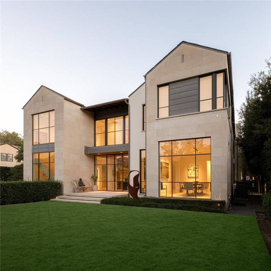 This stunning University Park estate, set on nearly half an acre, epitomizes luxury living in the Park Cities. Designed by SHM and built by Tatum Brown in 2019, it blends modern elegance with timeless European design. The striking exterior features Italian limestone, lush landscaping, and custom steel doors. Inside, a floating staircase and abundant natural light enhance the meticulously designed interior. With 5 bedrooms, 9.5 bathrooms, and 2,000 square feet of outdoor loggia space, this home is ideal for both grand entertaining and private retreats. The chef’s kitchen boasts Bulthaup cabinetry and top-tier Sub-Zero appliances. Dornbracht fixtures and integrated Tru-Fig technology add refined touches. Upstairs, the serene primary suite offers separate spa-inspired baths, a freestanding tub, steam shower, and Poliform Italian closets. Detached guest quarters feature a projector, Trackman golf simulator, Tonal e-gym, sauna, cold plunge, and a putting green. The turfed resort-style backyard includes a zero-edge infinity pool, spa, entertainment lounge, and outdoor kitchen. The expansive loggia seamlessly blends indoor and outdoor living with landscape audio, multiple gathering spaces, and a fireplace. With steel MHB doors from Holland, Lutron lighting, and Control4 automation, this home offers the finest in craftsmanship and technology. A detached four-car garage with a Renlita trifold glass door is a showpiece for automobile enthusiasts. Located within walking distance to the best dining, shopping and schools Highland park has to offer, this residence truly defines sophisticated luxury.