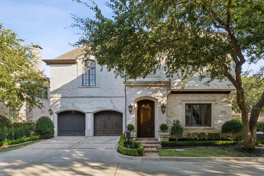 Back on the Market due to Buyers Financing! Luxurious Mark Molthan Platinum Series former model home with all the extras. Located in the coveted, gated community of Bretton Woods in Bluffview. 5470 sq.ft., 3-bedroom, 3.5 bathroom home with 30+ft cathedral ceiling in the living room with overlooking gallery. Formal dining room, distressed hardwood floors, custom finishes and a beautiful wine cellar. Huge gourmet kitchen with Sub Zero Wolf appliances, separate food and butler's pantries and additional dining area that opens to the covered patio with fireplace. Beautiful wet bars on both floors, and a theater-styled media room. Spacious master with seating areas, large en suite bathroom with built-ins, spa tub and spa shower. Large closet with great storage and built-ins. Additional office, in the master suite has dual workstations and a lot of storage. Steps out the front door is a Private 5-acre community park, easy access to the Dallas North Tollway, downtown, airports, shopping, restaurants and more.