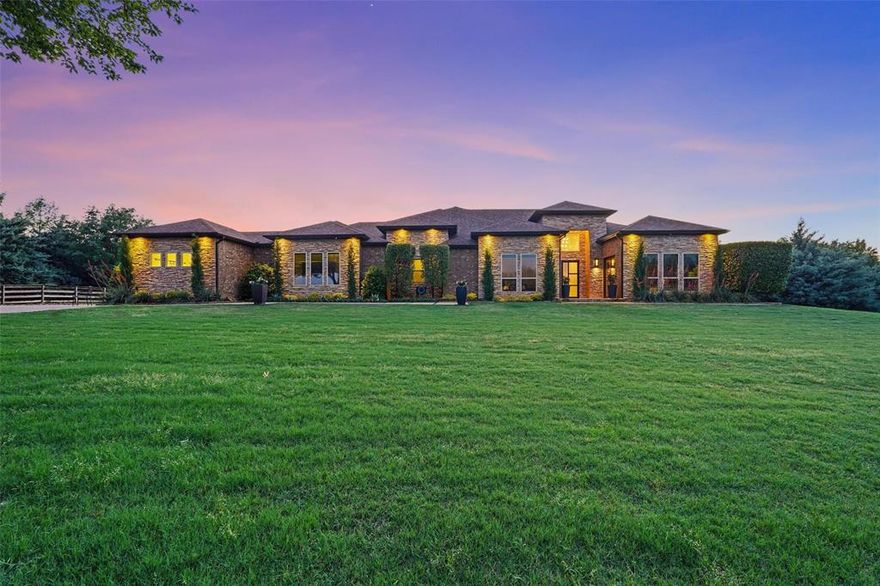 This incredible single-story custom home is a rare blend of luxury, function, and smart design — all set on a private, 2-acre lot in the highly acclaimed Lovejoy ISD. Featuring 4 spacious ensuite bedrooms, the primary suite is a true retreat with a custom mounted headboard, spa-inspired bath complete with heated floors, waterfall tub filler, dual entry shower with 8 spray jets, and a dream closet with built-in custom cabinetry. Adjacent to the primary suite is a flexible room that can be used as a private office or cozy sitting room — in addition to a second dedicated office space. The gourmet kitchen is a chef’s dream — boasting custom 9.5 ft bamboo-style cabinetry, oversized soft-close drawers, three kitchen islands, double ovens, a full walk-in pantry, and SUBZERO full-size refrigerator and freezer. Entertain with ease from the elegant wine bar off the dining area, featuring floating wine racks, custom cabinetry, sink, and wine cooler. The media room with full wet bar includes a dishwasher, mini-fridge, ice maker, and stunning feature walls. This smart home is equipped with CONTROL4 technology to manage lighting, AV systems, window shades, and thermostats with ease. Step outside to your private resort-style outdoor living space with a heated pool and spa, multiple lounge and dining areas, plus awnings for extra shade. Car lovers and hobbyists will appreciate the 2,400 sq. ft. climate-controlled man cave garage — fit for 10+ cars, an RV, or trailer — complete with car lift, custom cabinetry and workbench. Extras include holiday lights with a new timed controller and two 50 AMP plugs for added flexibility. Conveniently located near shopping, dining, and entertainment, this one-of-a-kind home is not to be missed!