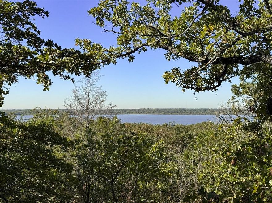 Over 10 acres of Ag-exempt land offering beautiful lake views and direct access to Lewisville Lake. Enjoy very low property taxes (only 1.34%) and no municipal charges. This property provides endless possibilities with multiple ideal build sites featuring scenic, elevated views.

Rolling terrain, native vegetation, and abundant wildlife create a peaceful country setting while still being close to all DFW amenities. Truly a rare opportunity to own acreage with lake access in this area.

Existing home structure is unfinished (open walls, no insulation, sheetrock, or kitchen).

Home sold as-is. Value is in the land.