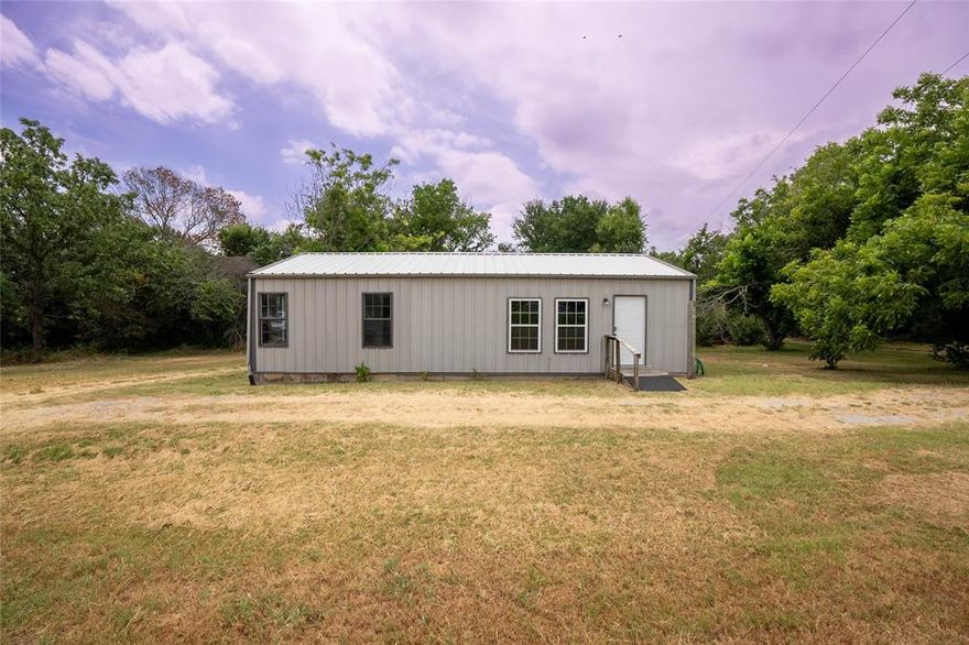 Experience the charm of country living in Tarrant County, just a quick 25-minute drive from downtown Fort Worth. Nestled on a spacious 1-acre lot, this cozy 950 sq ft barndominium features 1 bedroom, 1 bathroom, and a bright sunroom. The property is wheelchair accessible and includes laundry hookups, durable metal siding and roofing, central heating, fresh paint, and elegant bamboo flooring. Enjoy outdoor relaxation on the small deck overlooking mature pecan trees and a picturesque tree-lined pond on the western side of the property. Located on a quiet road off Silver Creek-Azle, this serene retreat is also a fantastic opportunity for commercial use or as a rental property.
