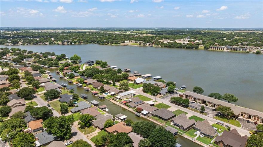 If you have been looking for a great waterfront home or a lake retreat to host a STR, look no further!  This value priced home is ready for fun and sun.  During the off season, update this place, it could be a show stopper!  With 3 bedrooms, 2 bathrooms and a garage that could be turned into a bunk room or game room, there are plenty of places for overnight guests.  There is an also a huge sunroom that looks out onto the water and the boat dock.  The neighborhood is very safe and convenient to Home Depot, Lowes and the historic square.  As an added bonus, watch the awesome fourth of July fireworks from your back yard.  Home has newer septic, newer room and all new carpet.