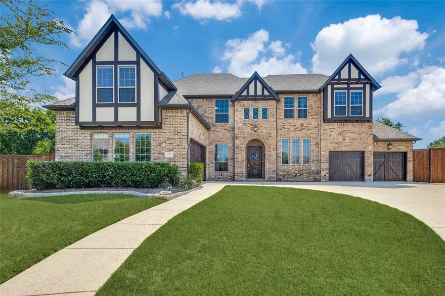 CUSTOM LUXURY ON A CUL DE SAC IN HIGHLAND VILLAGE 5 Beds – 5 Full Baths plus 1 Half Bath – Game Room – Media Room – Hand Scraped Hardwoods – 4 Car Garage. Built in 2017 in Wichita Estates, this 4,870 sq ft home in Lewisville ISD offers a large open floor plan with vaulted ceilings, wood beams, quartz countertops throughout, and designer tile in showers and on floors. Natural light floods the living and kitchen open floor plan area. The kitchen is built to impress with a huge walk in pantry, double refrigerator, tons of cabinet space, plus gas cooking and double ovens. The primary suite features a garden tub and an oversized shower with custom heads and body sprays. Situated on a massive 0.547 acre lot, enjoy a huge backyard, large driveway, covered patio, and tons of storage in the 4 car garage, with room for backyard RV parking. All appliances stay including WD and exterior above ground hot tub. Furniture is negotiable with the purchase. Walking distance to Lake Lewisville and Doubletree Ranch with easy access to 35E.