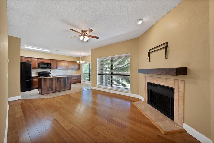 Updated Lake Highlands Condo with serene Creek Views!!  Discover the perfect blend of modern comfort and natural beauty in this beautifully updated 2-bedroom, 2-bath condo located in the Oaks-On-The-Bend community in Lake Highlands. This second-level unit backs to a lush greenbelt and peaceful creek, offering rare, scenic views right from your private balcony.  A private outdoor storage closet adds even more convenience.  Inside, the layout is bright and functional, featuring wood-look flooring. The updated kitchen boasts granite countertops, sleek black appliances, and plenty of cabinet space, all open to the cozy living area with fireplace and large windows that bring in tons of natural light. The spacious primary suite includes an en-suite bath and two closets, while the second bedroom offers great flexibility for guests, office, or both.  Washer, dryer, and refrigerator all convey with the home, making this move-in ready and ideal for both homeowners and investors.  Enjoy access to a well-maintained community pool and beautiful landscaping, with pet-friendly amenities including convenient disposal stations and well-lit pathways throughout the complex. The HOA covers water, sewer, and trash—so no water bill! Assigned covered parking is included, and the community is well-situated within Richardson ISD.  Just minutes from White Rock Lake, NorthPark Center, SMU, Lower Greenville, and the medical district, this location offers exceptional access to dining, shopping, fitness centers, and major highways. DART access is nearby, making commuting easy and convenient.  FHA and VA loans not eligible in this complex.  Two-bedroom, two-bath units with a greenbelt view are hard to come by in this community, making this a standout opportunity for buyers seeking both space and scenery!