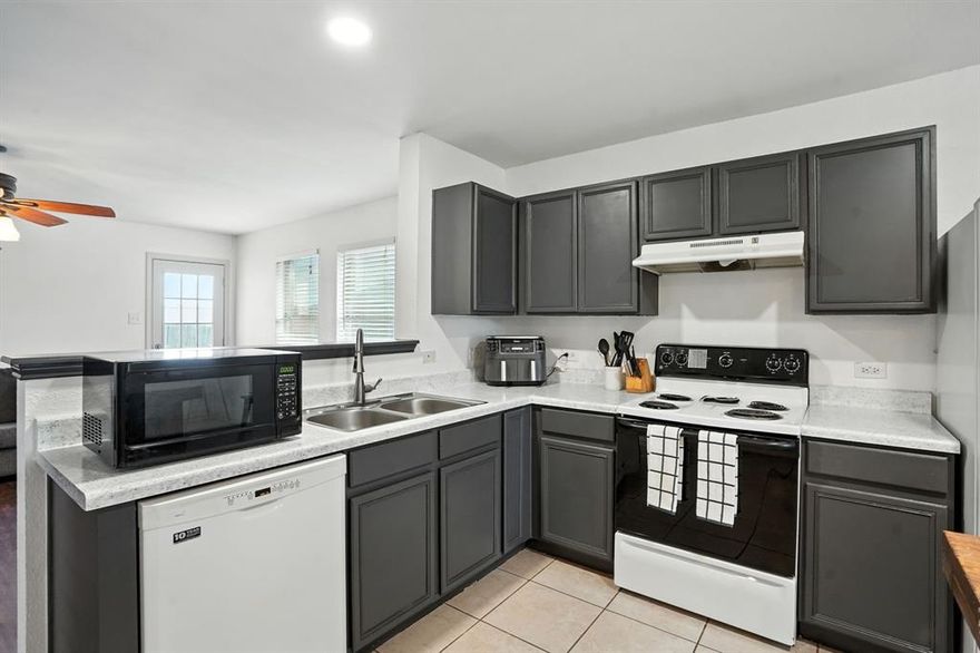 This 4-bedroom, 2-bath home offers a spacious and functional layout perfect for everyday living. The open living and dining areas flow into the kitchen, which features epoxy-coated countertops, dark-painted cabinets for a modern touch, and a large standalone island that adds extra prep space and casual seating options. A bright dining area sits just off the kitchen, ideal for family meals or entertaining.

The primary suite includes its own private bathroom, while three additional bedrooms provide space for guests, family, or a home office. Throughout the home, you’ll find ceiling fans, durable flooring, and a neutral color palette that makes it easy to add your own style.

Step outside to a large fenced backyard with a storage shed, fire pit, and plenty of room to play, garden, or expand with future projects.

Located in a quiet, established neighborhood just minutes from downtown Sanger, schools, shopping, and with quick access to I-35, this home combines comfort and convenience at a great value.