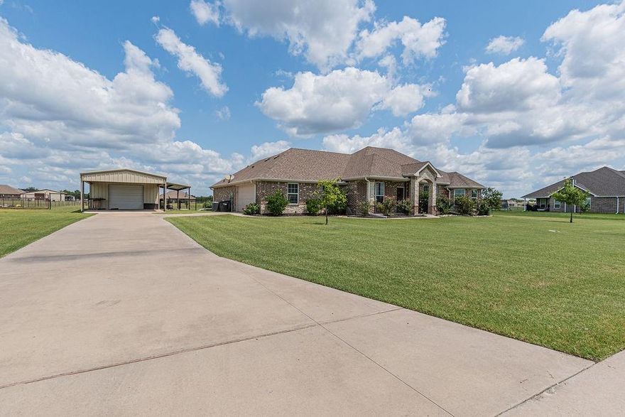 Nestled in the cozy Caddo Fork Estates neighborhood, this beautifully maintained 4 bedroom home with an additional office offers the perfect balance of comfort, function, and space. Featuring 2 full baths and a desirable split-bedroom floorplan, this property is designed for both privacy and togetherness. The open-concept living area boasts a stone fireplace as its centerpiece, seamlessly connecting to a spacious kitchen with a breakfast bar, eat-in dining area, flat cooktop, built-in oven and microwave, and plenty of cabinetry. The primary suite includes a large walk-in closet, linen closet, separate sinks, and a spacious walk-in shower for a spa-like touch. Step outside to a covered back patio overlooking your 1.5-acre cross-fenced yard, complete with an updated sprinkler system to keep the landscaping lush. For hobbyists or extra storage, the property includes a 20x30 foam insulated shop with roll up doors in the front and back, a 20x20 carport for extra covered parking, and an attached 10x30 shop patio that's perfect for entertaining or projects year round. With room to roam, plenty of parking, and a blend of rural charm in a neighborhood setting, this home is ready to meet all your lifestyle needs.