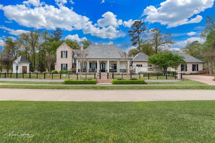 Esplanade, one of the finest gated neighborhoods in Shreveport, offers a central location, convenient to groceries, dining, shopping, & healthcare. Rolling topography, winding sidewalks, gently curving streets, & lake create a tranquil environment & unparalleled standard of living. Sited on the premier waterview lot in the Railsback District, this stunning, carefully-planned estate home boasts a peaceful setting, inviting architecture, picturesque landscaping, thoughtful design, impeccable craftmanship, luxury finishes, gathering spaces for friends & family, private spaces of respite, remarkable outdoor living, & more. Very rarely do homes of this caliber become available in our market. The home blends great design, high performance building materials, & the charm of traditional Southern courtyard living. Notable interior features- reclaimed pine beams & brick, impeccable masonry work,French bead shiplap, white oak flooring, inset cabinets, high-end appliances. 6-burner Wolf gas cooktop, convection steam oven, Scottsman “Sonic” icemaker, Wolf Coffee System, oversized hood, pot filler, farm sink. Calcutta Quartz countertops. Gym. Spacious Utility. Office. Secluded Master Suite opens to the rear courtyard, blending indoor and outdoor spaces. Luxurious Master Bath. Private guest quarters with ensuite baths, walk-in closets. Expansive patio. full Outdoor Kitchen. Evo Affinity Gas Cooktop, Evo Beverage Fridge, Fire Magic Warming Drawer, Scottsman “Sonic” Icemaker, Wolf grill, sink. Outdoor Living-travertine paving, masonry fireplace, phantom screens, mosquito mist system. Heated Pool & Spa with ledge. Outdoor Cabana with bath.Brick Courtyard with Sugar Kettle Fountain.Walk-in attic.Balcony with custom iron railing overlooks the lake. Side yard brick firepit and lake views. Pigeoneer for storage. Porte-Cochère. 4-Car Garage + additional parking. Generator. HEOS Sound & Security. Designed for an additional 663SF “Future Build” to include 4th bedroom with private en-suite.