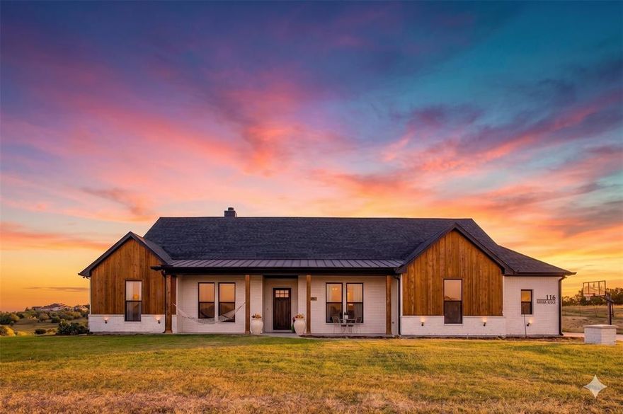Beautiful Custom Built Home in Peaster ISD Home on Acreage WITHOUT the HOA - mother in law suite or second residence ALLOWED! A truly move in ready Country Living Home with Horse Barn, horse stalls, cross fenced AND Workshop! The Horse barn is currently set up as a 3 Stall with runs extending past the large overhang & has power! Metal Shop on slab pad with power measures 30x20 - if you have projects then this is the place to be! This custom built KW Home offers a fantastic life friendly layout! Open plan gourmet Kitchen with gas cooktop - with pot filler, double ovens, farmhouse sink & huge Island is beautiful then add in the massive walk in pantry... as if that isn't amazing enough to store all the best treats - you have a FULL BUTLERS PANTRY suite tucked away off the Kitchen, complete with second sink, drinks station & more storage than you could dream of! The home office, with closet, overlooks the beautiful front acreage & is hidden by the custom built barn sliding door. Split Bedrooms, walkthrough Primary Closet connected to the Laundry room, located conveniently off the mudroom entry area from your HUGE 3 car garage. The private guest bedrooms each have their own vanity & walk in closet, with Jack & Jill Bath shower toilet combo. Cleverly planned half bath is situated at the rear of the home offering privacy AND a perfect location should you wish to add a pool! The covered back patio is the chef's kiss with its views of the horse barn while tucked under the shade with corner wood burning fireplace. If you are looking for the true custom home feel instead of settling on a spec home, without the added restrictions of a HOA then this is the one you want to hurry up and see! Bring the horses & start enjoying true countryside lifestyle today.