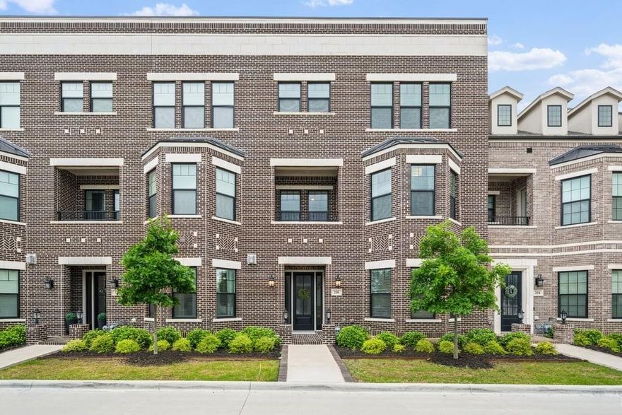 Experience elevated living in the heart of downtown Roanoke with this stunning brownstone townhome ideally positioned on a prime lot in the highly sought-after City Center community. Blending luxury finishes, thoughtful upgrades, and an unbeatable walkable location, this residence offers a true lock-and-leave lifestyle just steps from dining, nightlife, and entertainment. Inside, soaring ceilings and designer details create an upscale yet inviting atmosphere. The open-concept main living area flows into a high-end kitchen featuring stainless steel appliances, premium finishes, and the perfect setup for everyday living or entertaining guests. Custom lighting fixtures, upgraded designer carpet, and stylish barn doors add character throughout the home. The spacious second-floor primary suite is a standout retreat, complete with a large walk-in closet, dual vanities, and an oversized spa-inspired shower. Just outside, enjoy a private covered patio—an ideal place for morning coffee or evening relaxation. Upstairs, the third level offers flexible living space highlighted by a built-in wet bar with wine cooler, perfect for hosting or creating a private lounge area. Step out to the rooftop deck and covered patio where you’ll enjoy impressive views and an ideal setting for entertaining under the Texas sky. Additional highlights include a private elevator for convenient access to all levels, a two-car garage with a hookup for a portable generator, and low-maintenance townhome living. Located in vibrant downtown Roanoke, you’ll love the live-work-play atmosphere with restaurants, bars, and local events just outside your door, while remaining only minutes from major highways and Dallas-Fort Worth International Airport. This is a rare opportunity to own one of Roanoke’s premier luxury townhomes.