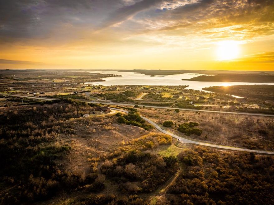 Potential first floor lake view with even better views if building a two story! This 2+ acre lot give both elevation and with a second story home, you could be able to watch where the mighty Brazos spills into and forms the head of Possum Kingdom Lake. Enjoy stunning sunsets, and exquisite valley views. The Hills Above Possum Kingdom offers parks, fishing ponds, a club house, fitness center, community pool, boat storage, boat launch, courtesy dock, and more. Come check out this beautiful property and make it your own.