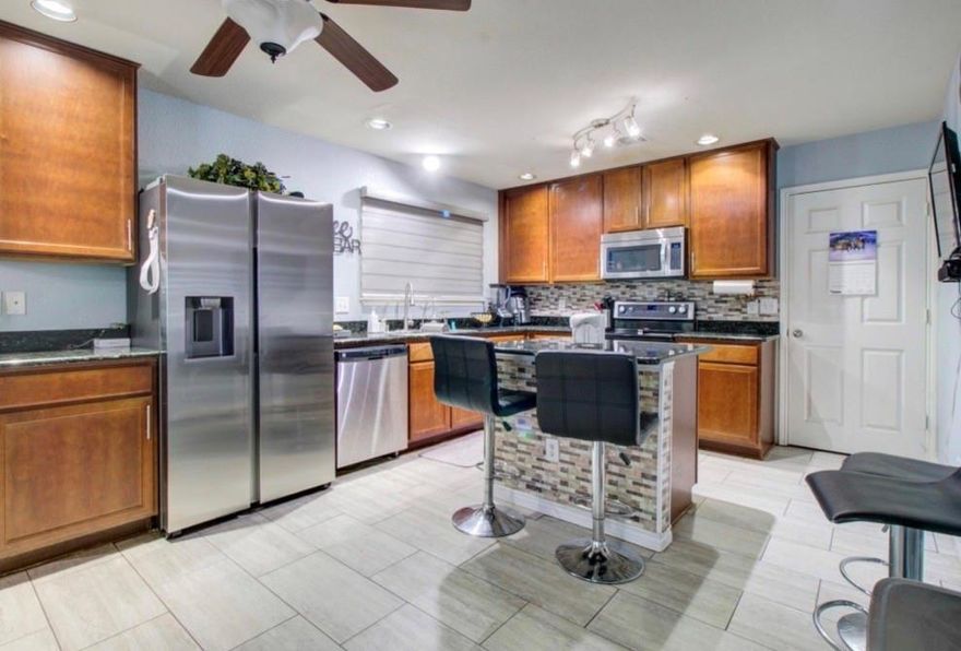 One of a kind opportunity to own this home with unlimited potential for extra income as an Airbnb-VRBO, Multi-Generational Family use or Guest quarters.
This beautifully updated home sits on an oversized double lot, featuring a 3 bedroom main home plus FOUR additional tenant or guest units all on the same property. Currently operating as a successful short-term rental with two units already leased -one through March and another through October- for immediate income potential. Three units are attached and one is a stand alone guest home. 
*PROPERTY HIGHLIGHTS*
Main residence plus 4 extra tenant or guest units on one large lot, ideal for multi-generational living, house hacking, or investor seeking multiple income streams.
Spacious double lot with generous yard space and mature surroundings, offering room to relax, garden, or further enhance outdoor amenities.
Gated rear access with extra parking in the back, perfect for multiple vehicles, guests, or short-term rental turnover days. 
Dedicated storage unit equipped with a full washer and dryer for guest or tenant use, adding convenience. 
What to expect-Main home has 3 bedrooms, a game room, dining, living room. Guest house has a loft bedroom with living room and kitchen. Upstairs guest has two bedrooms and full bathroom *one room used to have a kitchen so can easily be added back* Downstairs attached is a two bedroom with living room and kitchen. Smaller unit is a studio with bedroom, living room combo with kitchen. 

Information is deemed reliable but it's up to the buyer and buyer’s agent to verify all zoning, STR restrictions, permitting, and tenant lease details.
Showings require advance notice to respect current occupants and guests.