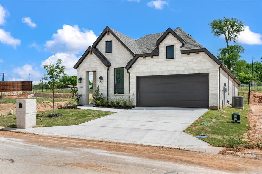 This custom plan is a part of the exclusive Jewel Collection by OCH, is thoughtfully designed for both comfort and style within the gated community of The Resort at Eagle Mountain Lake.

The home highlights a spacious open-concept living, dining, and kitchen area, perfect for entertaining or relaxing with family. The primary suite offers a private retreat with dual sinks, a walk-in shower, soaking tub, and a generously sized walk-in closet. The living space seamlessly flows to a covered patio and backyard, creating the perfect indoor-outdoor connection.
Additionally, you’ll find two secondary bedrooms and a full bath, a powder bath for guest, mud room and utility directly off two car garage.