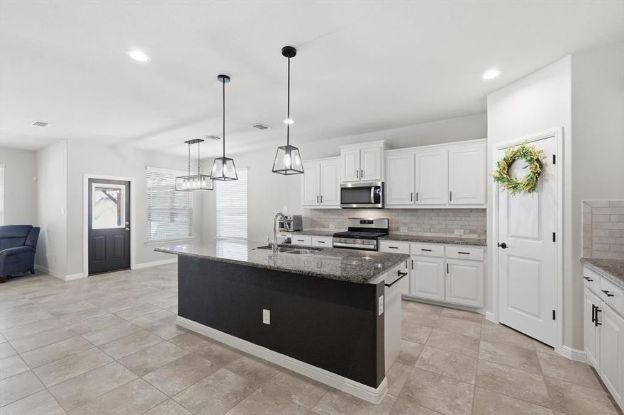 8809 Thompson Road is a beautifully designed DR Horton single-story home that blends comfort, functionality, and thoughtful upgrades—perfect for modern living. The spacious kitchen is a true centerpiece, featuring granite countertops, abundant cabinetry, a walk-in pantry, and a charming coffee bar ideal for busy mornings or relaxed evenings. It opens seamlessly to the inviting family room, where an electric fireplace creates a warm and welcoming atmosphere. The small office space between the kitchen and living room features a matching built-in countertop that functions as a desk.The flexible floor plan provides three secondary bedrooms plus a versatile flex space—perfect for a home office, playroom, or additional living area.The private primary suite is a relaxing retreat, complete with a garden tub, dual vanities, and a spacious walk-in closet featuring custom shoe storage. Designed with everyday convenience in mind, the oversized laundry room includes a built in laundry folding table, while the adjacent mud area offers practical storage with built-in hooks. Step outside to a 150 square foot covered patio with a pergola, thoughtfully designed for seamless entertaining, enhanced by a separate fire pit area and a versatile storage shed for added convenience and functionality. Additional highlights include a bonus refrigerator that will convey with the home and a prime location just moments from the elementary school—making this property as convenient as it is charming. Harvest Community boasts pools, nature trails, parks, organized community activities, and a town green. If you're looking for an active, family oriented community, come check out this beauty!