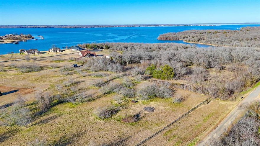 Discover this stunning 1.18-acre property with breathtaking water views! Nestled in a gated community on the shores of Richland Chambers Lake, this lot offers the tranquility and privacy you've been looking for. SouthPoint boasts exceptional amenities for the whole family, including a resort-style pool, a boat ramp for all your aquatic adventures, and a scenic pier to enjoy the water. The community is equipped with underground utilities, a central water system, and paved roads for added convenience. With deed restrictions in place for site-built homes and no time limit to build, you can design your home at your own pace. Don't miss out on the chance to experience lakefront living—come see this prime property today and start planning your dream home!