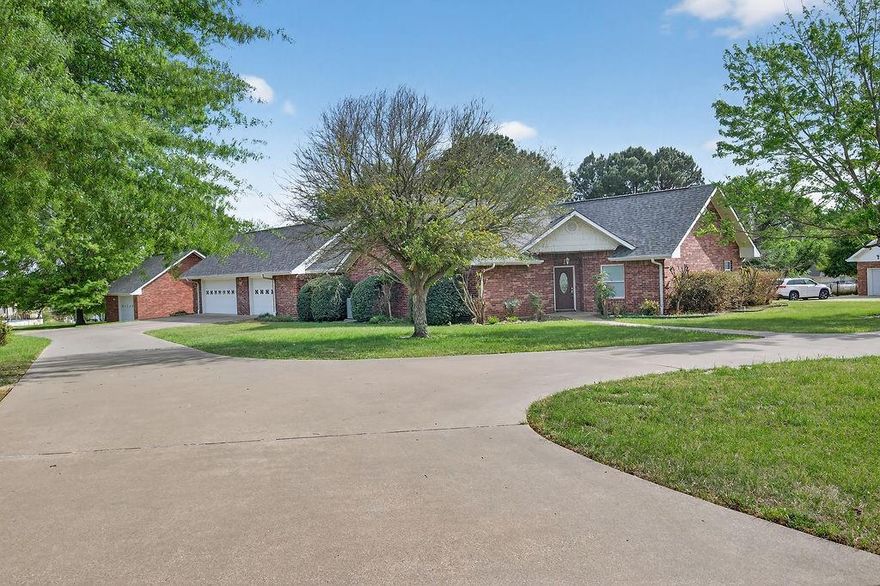 Built in 2004, this 2,024 sq. ft. home offers 3 bedrooms and 3 bathrooms on a full acre just outside the city limits—enjoy no city taxes and a peaceful setting near Lake Athens. Located on a quiet dead-end street, this property provides minimal traffic, scenic lake views, and frequent visits from local wildlife, including deer. Inside, you’ll find an open living and kitchen layout with raised ceilings, granite countertops, a pantry, central vacuum system, and abundant storage throughout. The split-bedroom floorplan offers added privacy, while the spacious primary suite includes a walk-in closet. Recent updates include a brand-new roof (2026) and two tankless water heaters for efficiency and convenience. Step outside to a covered back patio perfect for relaxing and taking in the serene surroundings. The property also features a three-car attached garage plus a detached one-car garage or shop with additional storage. Just a short drive to the marina, this home combines comfort, functionality, and the best of lake area living. Interior pictures will be added after estate sale.