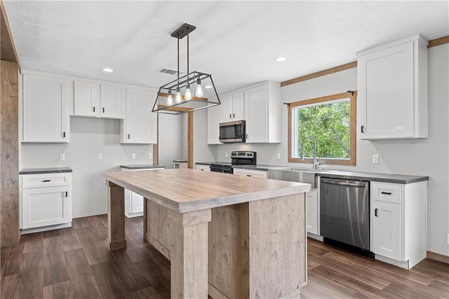 Stylish and recently refreshed, 4 bedroom, 2 bathroom home in Eddy, TX! The open and crisp feeling of the kitchen is perfect for both entertaining and every day enjoyment. The primary suite offers a spa like bathroom with dual sinks, a garden tub and separate shower. New carpet, some new appliances, new paint throughout - this might be the prettiest manufactured home you have ever seen - all on 1 acre! Enjoy a fresh start on this large, corner lot, with room for a garden or small animals in a lovely country setting.