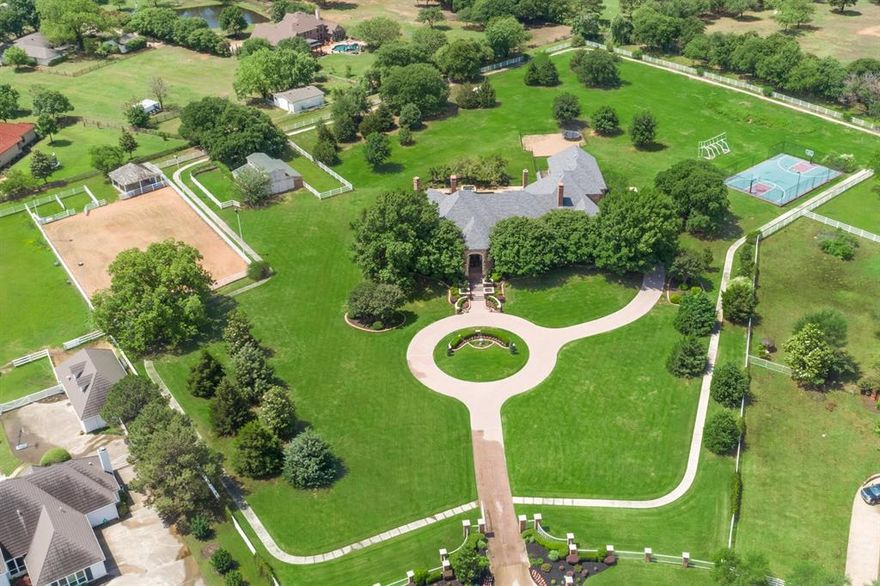 Secluded estate located in the heart of Colleyville in an Equestrian Neighborhood with community bridle path and lighted riding arena! This elegant home features a gated entry, almost 6 acres, a private walking-jogging concrete path surrounding the property,  a sports court, and a barn. Upon entry you are greeted with amazing views of the property. Excellent floorplan with 2 wings and guest quarters. Downstairs Media Room, Office, and Primary suite featuring a fireplace! Upstairs Gameroom with wet bar and a balcony overlooking the estate. Outdoor Living with fireplace and built-in grill! Approx. 10 ft. deep diving pool, attached spa. Bring your horses! 4 stalls barn featuring feed room with water and electricity. Two paddocks are connected to the barn. This is truly a horse lover property! It is a must see.