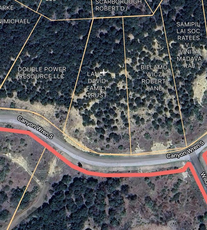 Elevated lot with a panoramic view of the surrounding country side. Lot ownership permits the use of all neighborhood amenities including clubhouse with pool and fitness center, boat storage, community dock, boat ramp, cabin with oicnic area, fishing pon, walking trail, and twenty miles of private roads behind the gates.