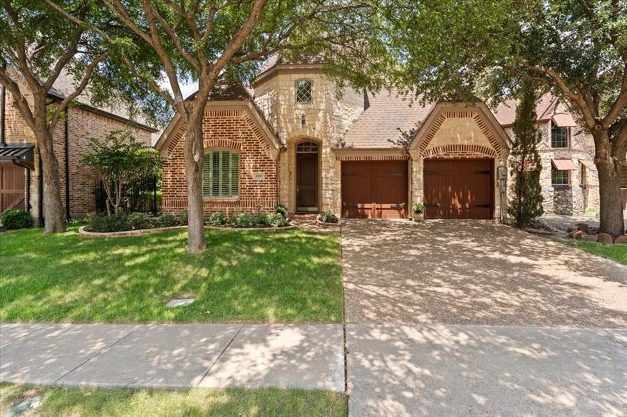 Step inside this impeccably maintained single story nestled in the gated Lakes at Legacy. Once inside you'll be greeted by sweeping hardwood floors flowing into this open concept floor plan. Create memories to last a lifetime gathered with friends and family in the living room highlighted by built-in shelves flanking a gas fireplace and wall of windows with plantation shutters illuminating the room with natural sunlight. Make your way into the gourmet kitchen equipped with granite counter-tops, gas cooktop adorned by a stone accent wall, built-in Monogram fridge, upper and under-mount lighting and GE appliances. The serene primary suite offers a tranquil bath with dual sinks, jetted tub, separate shower and walk-in closet. Working from home is a breeze with french doors leading into a study situated off the foyer. Relax and unwind outdoors on the charming patio with plenty of grass for kids and pets to enjoy. Desirable location just minutes to The Star, Legacy West, and DNT.