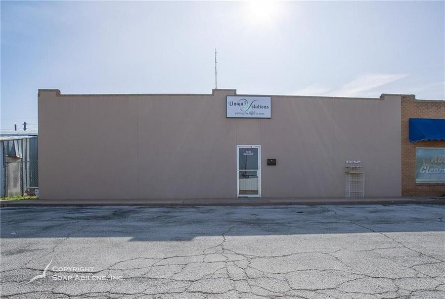 This unique office building with alley access shop space features 2500 square feet of office space and 2500 square feet of shop, or industrial workspace. The office area contains 2 double offices and 4 single offices, as well as a reception area, kitchen area and 2 bathrooms. The building was renovated in 2019 from top to bottom, sheet rock, trim, doors, drop-down ceilings, trough lighting, bathrooms, fixtures, flooring and HVAC system. The shop area is equipped with two bay doors which open up to the back of building for alley access. One bay opens up to a fenced area for additional storage for trailers, etc. This is the perfect location for any business needing a combination of office and industrial space. Call to schedule your appointment today!