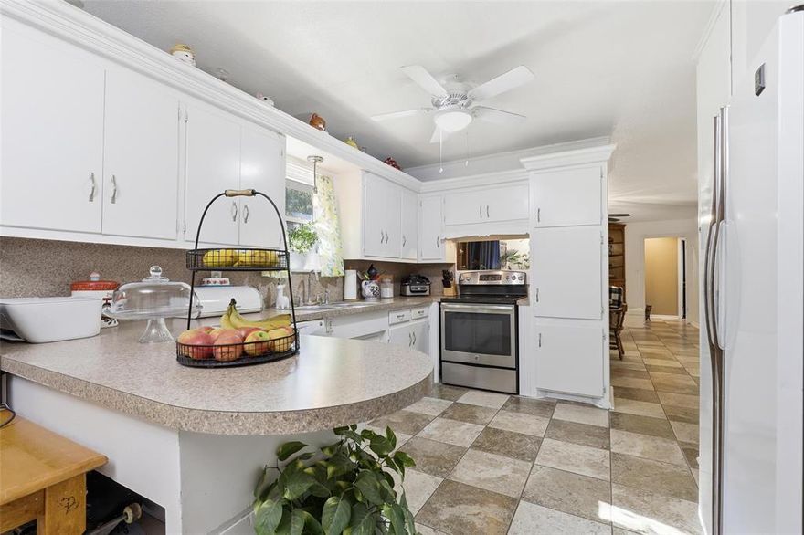 Classic Mid-Century Charm in Highly Sought-After Wedgwood!  Step into this inviting home that captures the timeless mid-century modern feel of the    neighborhood. Featuring open formal living and dining areas plus a cozy second living space with a fireplace — perfect for relaxing or entertaining. The warm and welcoming kitchen offers ample cabinet space and two large pantries for exceptional storage.  Durable ceramic tile flooring flows through the main living and kitchen areas, with vinyl plank flooring in all bedrooms. The home features three spacious bedrooms, including a primary suite with a private ensuite bath. New windows installed in 2019 provide efficiency and natural light throughout.  Located in a prime Fort Worth location with easy access to schools, shopping, freeways, the airport, and downtown, this home is competitively priced — a fantastic opportunity for buyers looking to make Wedgwood their new home!