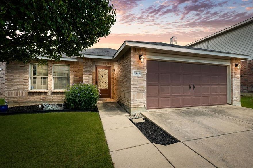 ~Sparkling Slice of Sunshine!~ Bright & beautiful single-story in the heart of Harriet Ranch of Fort Worth (Justin), Texas just minutes from the Texas Motor Speedway! Feel the Roar of the Track the moment you arrive at this gem, where lush landscaping, double coach lights, carriage-style garage, mature Bradford Pear with tree-ring & vibrant Mexican Petunia lead you to the elegant front door with frosted glass & wrought iron scrollwork inset radiating with Mediterranean charm! Open, flowing & oh-so-free layout bursting with charm at every turn! Luxury laminates, updated fixtures, fresh carpet, oversized baseboards, and Love from top to bottom! Fall in love with your built in LR cabinets, perfect combo of a designated dining and eat-in kitchen, recessed lighting, sleek stainless steel appliances, built-in microwave, gooseneck brushed nickel sprayer faucet, frosted glass pantry door opening to HUGE walk-in pantry, spacious primary suite with ensuite featuring garden tub & separate stand-up shower, decorative shelving, roomy walk in, backyard with dog runs for the pups and so much more! Tucked in the heart of Harriet Creek Ranch and Northwest ISD, this neighborhood delivers the perfect balance of comfort, convenience, and community. Families love the two sparkling pools, playgrounds, and scenic jogging and bike trails, while weekends bring easy adventures just minutes away at the Texas Motor Speedway, Buc-ee’s, and Tanger Outlets. With quick access to I-35 and Highway 114, the entire Alliance corridor of shopping, dining, and entertainment is right at your doorstep. Children attend the highly acclaimed Northwest Independent School District, with an elementary school right in the neighborhood and Northwest High School just steps away. It’s suburban living with unbeatable connections to the very best of DFW. Ready when you are! Stop Looking & Start Packing!