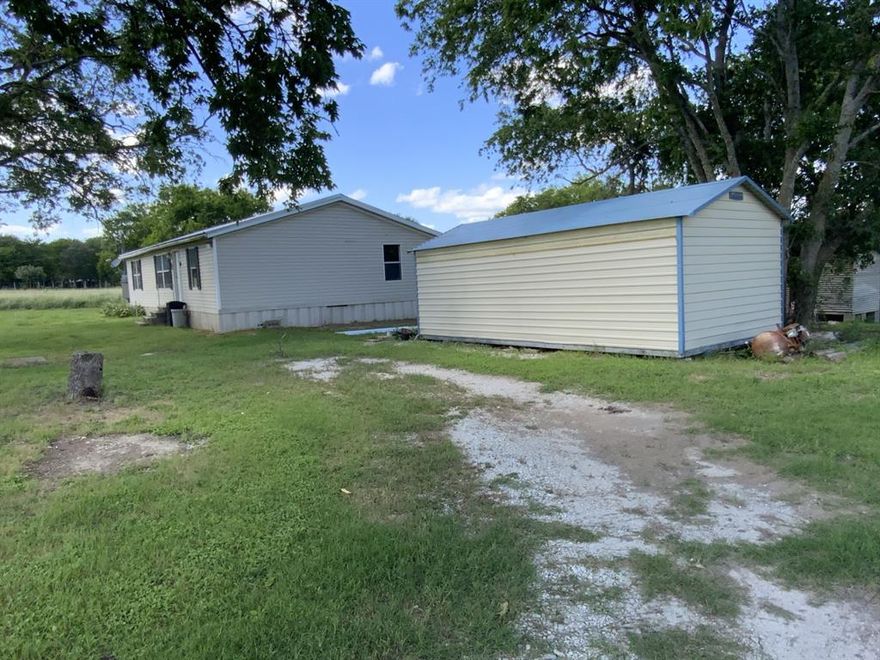 This Mart country home has 2.3 acres of space to enjoy a garden and or livestock. There are 2 sheds, one is 288 sq. ft. and the other is 144 sq. ft of storage space. New carpet in living room and primary bedroom. Metal roof installed in June. The shade trees in the front yard will make a nice area to enjoy the country breeze and the sounds of birds. Hurry out to see this one and get it while it lasts.