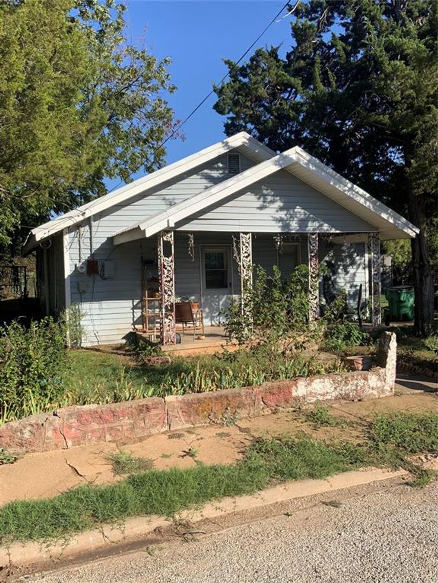 This Home sits on two city lots and has 2 bedrooms and one bath a living room with a wood burning fireplace another room could be used for possibly a 3rd bedroom or office space features a metal roof and is close to schools, a park, shopping, churches, gas stations, industry and camping. Come make this your new home or investment property.