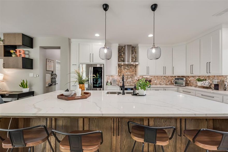 Welcome to 521 Smokebrush St, where design meets lifestyle. This isn’t your typical Light Farms home, it’s a custom, mid-century inspired stunner set apart by thoughtful upgrades inside and out. From the moment you pull up, you’ll notice the fresh exterior paint, charming architectural lines, and inviting curb appeal. Step inside and you’re greeted by light-filled spaces, wide-plank floors, and a designer kitchen boasting a waterfall island, sleek backsplash, and custom cabinetry that looks straight out of a magazine. Finished with Top of the line stainless steel smart appliances.

The first level primary suite feels like a boutique retreat, complete with a spa-inspired bath, dual sinks wrapped in custom cabinets, and a rainfall shower with his and hers shower heads, set in custom tile. Upstairs, a loft offers flexible living space for movies, work, or play. Every corner of this home has been carefully curated—nothing here feels builder grade.

But the true showstopper? The extended covered patio, designed for year-round entertaining. With its pitched roof, wood-burning fireplace, ceiling fans, heat lamps, surround-sound wiring, and plenty of room for lounging or dining, it’s as functional as it is beautiful. Rain or shine, this outdoor living space protects your home and invites you to linger a little longer with friends and family.

Life in Light Farms is more than just a home—it’s a culture. Miles of trails, resort-style pools, fitness center, tennis, pickleball, dog parks, playgrounds, an on-site elementary school, and year-round community events make it a place where neighbors quickly become friends. Here, every weekend feels like a staycation.

If you’ve been waiting for a home that blends architectural charm, custom upgrades, and an unbeatable community, 521 Smokebrush is the one that makes moving worth it. See attached documents for complete list of upgrades.