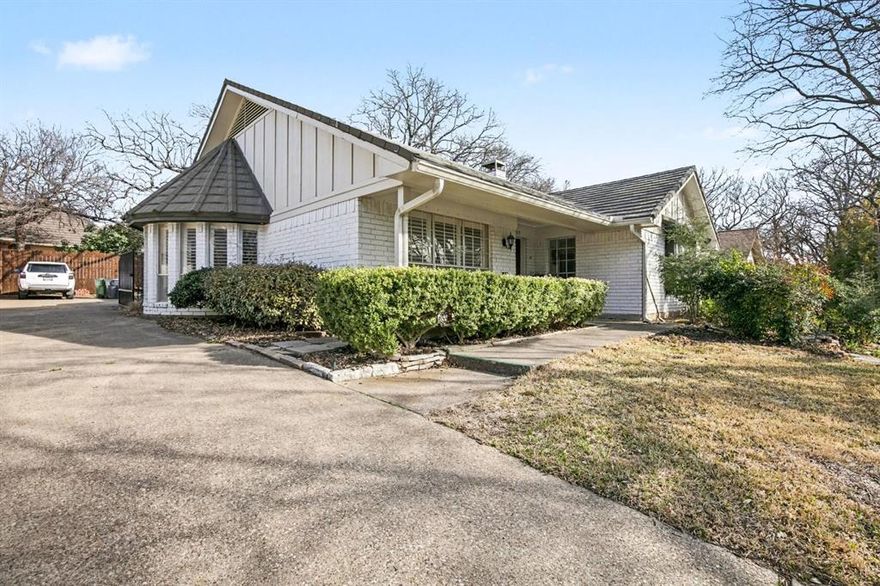 Welcome to this charming Wimbledon Addition home nestled on a picturesque, tree-lined street in Southwest Arlington! This beautifully maintained 3-bed, 2.5-bath, 2,479-sqft residence offers timeless appeal with thoughtful updates and a functional floorplan perfect for everyday living and entertaining.
Step inside to discover a cozy living room with a masonry fireplace and warm wood paneling, an oversized den with a wet bar, and a separate dining area — all flowing seamlessly for both relaxed family evenings and gatherings with friends. The updated kitchen features abundant natural light, charming views of the backyard, and ample space for casual dining and meal prep.
The spacious primary suite boasts dual vanities, generous walk-in closets, and a private en-suite bath, while two additional bedrooms with ensuite access provide comfort and privacy.
Outdoors you’ll find a private, fenced yard with mature trees, a peaceful front porch for morning coffee, a patio for outdoor dining, and a large storage shed. Additional upgrades include plantation shutters, new electrical panel, updated HVAC, new garage door, hot water heater, and a metal roof — peace of mind included!
Located in the Mansfield ISD, this traditional home blends classic character with modern comforts — a must-see property in a sought-after neighborhood!