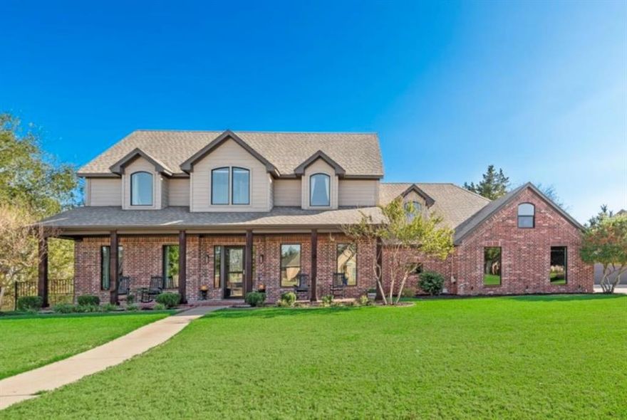 Welcome to this stunning 4,995 sq.ft. custom home nestled on a full acre in a quiet, gated community within the award-winning Midlothian ISD. Featuring 5 bedrooms and 4 bathrooms, this beautifully updated residence combines luxury, comfort, and privacy. The chef's kitchen, renovated in May 2025, showcases a 13-foot island, Zline Paramount Series 6-burner cooktop with Italina brass burners, and exquisite Taj Mahal quartzite countertops. Entertain with ease in the outdoor kitchen-added in 2024—with a built in Blaze grill, Blackstone griddle, two-burner cooktop, and mini fridge, or relax by the fire pit beside your sparkling pool. Additional upgrades include brand new windows (2025), fully renovated bathrooms (2025), epoxy-coated garage floors, and a screened sunroom (2024). The detached garage features RV and EV plugs, along with an oversized entry for a lifted trucks...all this  plus a workshop and a walk-up attic. The main garage features a underground storm shelter and also provides ample room for 2-cars. Enjoy this established, gated neighborhood with low HOA fees, NO CITY TAXES, elegance and practicality make this one the perfect home. This house has so much to offer! Schedule your private showing today!