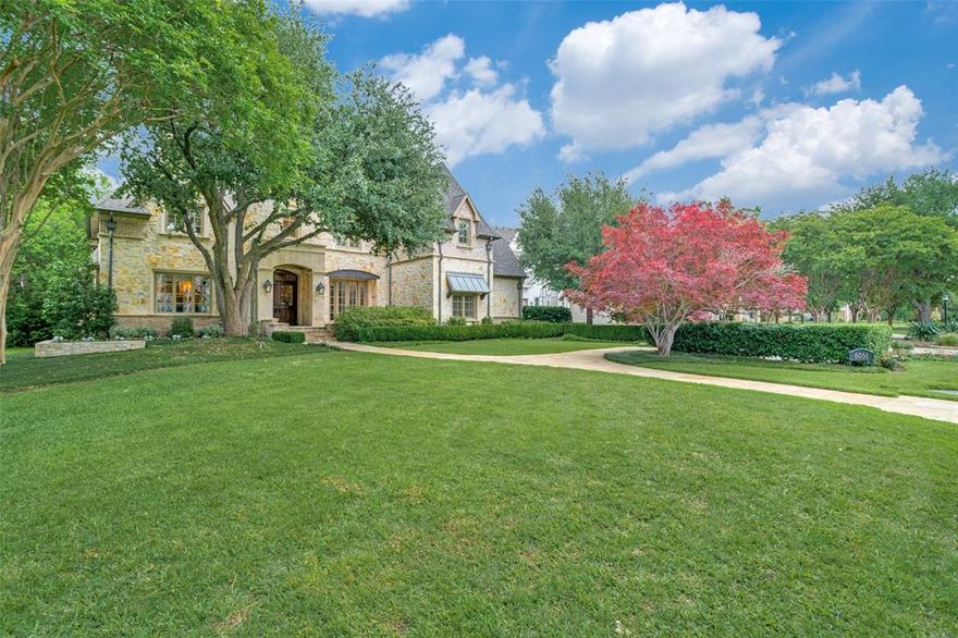 Beautifully maintained classic home in fairway of Preston Hollow! Lightly scraped hardwoods throughout and large windows let in much light.Large landscaped front yard leads to covered porch and lovely entry. Living and dining rooms flank foyer, which also leads to warm wood paneled library with great builtins and double sided fireplace. Large family room with beautiful vaulted and beamed ceiling has fireplace and wall of french doors leading to patio and rear yard. Family room opens to kitchen, also with beamed ceiling, builtin stainless appliances, large island and adjacent breakfast room. Downstairs primary bedroom overlooks rear yard and has spacious bath with dual sinks, large jetted tub, separate shower and spacious walk in closet. Secondary downstairs bedroom is off kitchen has adjacent full bath. Laundry and another smaller office also off kitchen. Upstairs there are 3 additional bedrooms with ensuite baths, another living area and gameroom. 3 car attached garage. Backhouse may become pool or guest house or storage. This home has everything and is close to shopping, restaurants, and schools!