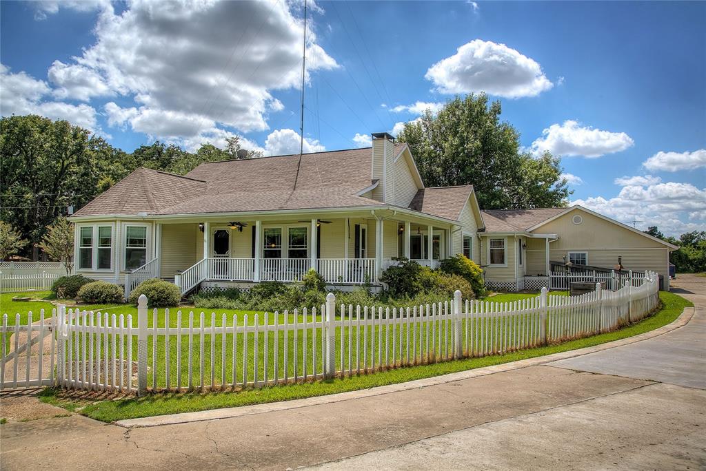 This property has it all! More than 3600 sf of living area with 4Brs, 3.5Baths, loads of living areas, granite tops in the kitchen and baths, 2 fireplaces, play room, exercise room, wood floors, and zoned AC.  Plus, outside you have a dream gunite pool with diving, slide, grotto water feature, covered areas and tree shaded relaxation.  There is a 30x60 workshop building that can accommodate hobbies, or operate an onsite business, RV cover, and a detached office complex with bath that could be used as a guest house. All located on a beautifully landscaped 2 acres of land.  This home has every feature you could want for your family.  Live, work and play right from home. The Receiver is a Lic. RE Broker 0138206.