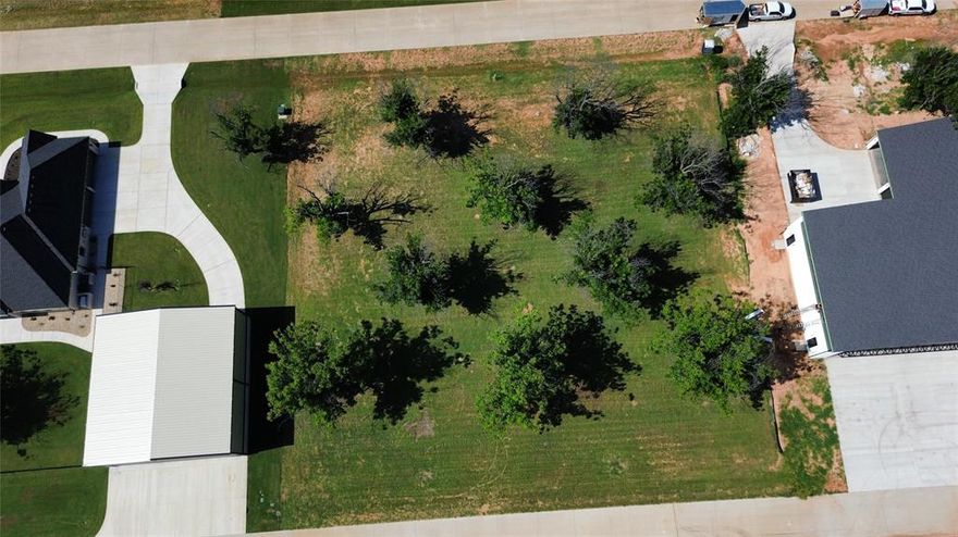 Fly in and see this ready-to-build lot in the highly sought-after Landings Airpark within Pecan Plantation. This is a rare opportunity to design and build your dream home and private hangar in one of Granbury’s most unique communities. The Landings features a 3,100 x 50 ft paved runway, concrete taxiways, and a newly added self-serve fuel station with tie downs. Paved roads, electric, high-speed internet, water, and sewer are available to the lot, and there is no time limit to build. Hangars may be constructed with your residence but cannot be built prior to the home. A minimum of 2,000 square feet is required for residential construction.

Pecan Plantation offers resort-style amenities including two 18-hole golf courses, two private airparks, a marina, equestrian stables, clubhouse with hotel and restaurants, riverfront parks, two pools, tennis and pickleball courts, dog parks, and an activity center. Whether you’re a pilot or simply seeking a peaceful, amenity-rich community, this property is a must-see.