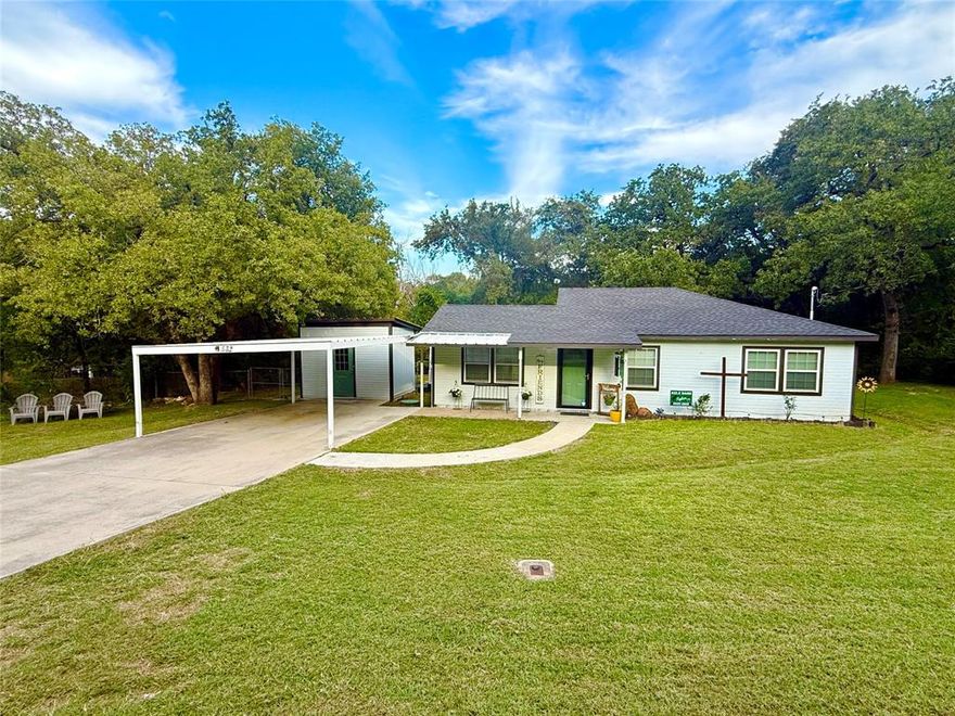 Charming two bedroom and two bath - move in ready - home that is just minutes away from Eagle Mountain Lake! This updated property offers the perfect comfort and convenience with no HOA. This gives you the freedom to truly enjoy your space.  You will enjoy bright and inviting living spaces with modern finishes. Kitchen features include granite countertops and plenty of storage.  The large dining area is perfect for gathering.  The lot includes a large yard with mature trees. There is a workshop with electric and a window unit for all of your tools, hobbies or lake gear. There is also a second building for storage.  There is a covered carport with cement driveway for ample parking. Govee lights are attached to the residence and can be customized to any color or to use as security lights.  They are programable for themes and lighting patterns.  Located in a peaceful neighborhood and provides easy access shopping, dining, schools and of course Eagle Mountain Lake for boating, fishing and outdoor fun. Don't miss your chance to make this home your own.  Schedule a showing today.