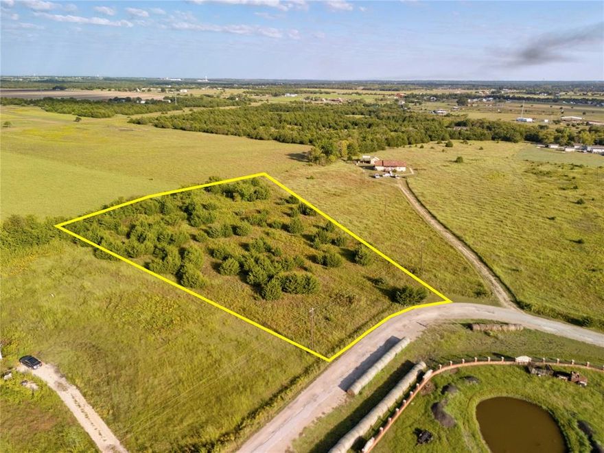 Discover the wide-open possibilities on this 2.17-acre parcel in Caddo Mills.   Co-Op water and electric access and no deed restrictions, this land invites you to build, grow, or invest with ease. Whether you dream of a custom home, barndominium, or weekend escape, you’re not boxed in by HOA or zoning constraints.  The property is ready for septic install, with essential utilities at the road. Located just 20 minutes from Greenville, 40 minutes to Rockwall, and 45 minutes from McKinney, this spot strikes a sweet balance between peaceful privacy and access to major hubs. Enjoy sunrises over open sky, the quiet of country living, and room to breathe all within a short drive to shopping, dining, and schools. Whether you’re starting fresh or expanding your vision, this land makes it feel possible.