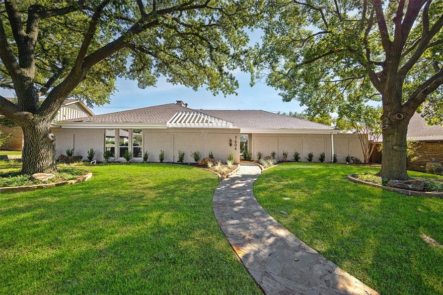 Surrounded by time-honored trees in the enchanting neighborhood Highlands North in Prestonwood, this home embodies modern luxury, nostalgia, and opportunity. Masterfully reimagined by Maverick Design, the 4-bedroom residence exudes elegance at every turn—seamlessly blending contemporary sophistication with enduring charm. Open walkways, vaulted ceiling, and streams of natural light accentuate a meticulously crafted floor plan. The breathtaking light-filled dining room adjacent to kitchen sets the tone for both intimate dinners and lively gatherings, while a brick fireplace with built-in books on either side commands attention in the adjoining living space.  At the heart of the home lies a chef-inspired kitchen, where custom cabinetry, sleek countertops, and a professional 6-burner gas range create a dream setting for culinary exploration. The back prep space with ample counter space leads to a charming covered patio, perfect for morning coffee. Designed for privacy and comfort, the split layout features a tranquil primary suite with direct patio access, a cozy sitting area, a spa-like ensuite with dual shower heads and oversized primary bathroom. Three additional bedrooms provide flexibility for guests, family, or a home office, complemented by a Jack and Jill bathroom and a convenient half bath. Outdoors, the low-maintenance backyard invites effortless entertaining—complete with a refreshing pool to unwind beneath the Texas sky.