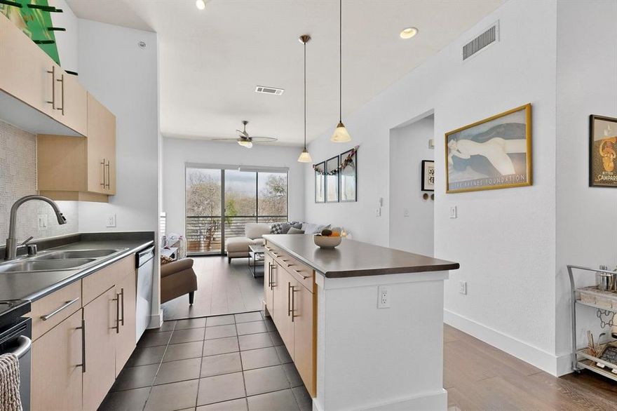 Courtyard-facing corner unit featuring automatic blinds & a highly private layout in an amazing Uptown Dallas location! As a top-floor end unit, this condo has no neighboring unit immediately beside or in front & does not align directly with the unit across the hall, providing an extra level of privacy AND quiet. A bright, welcoming floor plan opens to the kitchen & separate dining area, complete with a large kitchen island, pendant lighting & SS appliances. High ceilings & oversized windows allow for tons of great natural light throughout, plus a sliding door opening to a Juliet balcony in the living room, complete with automatic shades. The bathroom is extremely spacious & has multiple entries for easy access from the primary bedroom & main spaces, featuring dual sinks & a huge walk-in closet. Second bedroom could be used as an office, studio, workout space or guest room. Utility closet with full-size washer & dryer area can be closed off when not in use. Amenities in this gated community include covered parking, a saltwater pool, gym & dog run—the full package! Right down the street from Craddock Park, 5 minutes to Love Field airport & steps from the heart of Oak Lawn, Downtown Dallas, Arts District, Hospital District & West Village—you won't want to miss this fabulous condo in an unbeatable location.