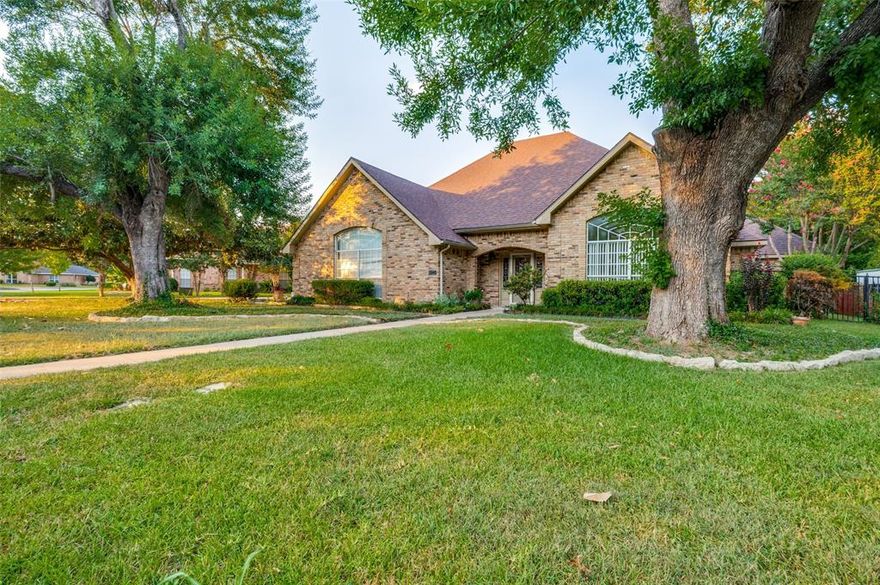 This Wonderfully Designed Single-Story Home with POOL in the Desirable Huntington Park Subdivision offers the PERFECT BLEND of Comfort, Elegance, and Functionality. Situated on over HALF AN ACRE with Creek and Trees Along the Back; the property provides BOTH natural Beauty and Privacy. Spanning nearly 3,000 sq. ft., this Custom Home was designed with Entertaining in mind . The Spacious Family Room features Raised Ceilings, Custom Paneling, Built-in Shelving, and a Beautiful Floor-to-Ceiling Stacked-Stone Gas Fireplace with a Wood Mantel. The Gourmet Kitchen is a Chef’s Dream with a Large Island with Cooktop, Quartz Countertops, Double Ovens, Built-in Desk, Cabinets Galore for Abundant Storage and a Huge Breakfast Bar that flows seamlessly into the Dining Area open to the Family Room--Such Openness Combined with Access to Formal Dining Room on the other side of Kitchen ALL Flows Together Creating Optimal Gathering Space! This Custom Home includes FOUR Bedrooms and THREE FULL Bathrooms with Split Bedroom Layout. One Bedroom is Readily Suited as a Home Office with a Built-in desk and Extensive Shelving. The Private Primary Suite features a Recessed Ceiling, Windows for Gorgeous Backyard VIEWS, Dual Walk-in Closets, Dual Sinks, Jetted Tub with Stained Glass Window and a Separate Walk-in Shower. The secondary Living Room provides flexibility as a Game room near the Wet Bar and access to the SUNROOM that Opens to the Spectacular Backyard. Outside--Your Private Oasis Awaits with a Sparkling Pool, relaxing Spa, Lush Grassy play area, and a Covered Outdoor Patio featuring an Authentic South American style Grill or Parrilla for Open-fire Cooking—PERFECT for entertaining! Additional Highlights include: Full Size Utility Room with Sink, New Carpet, Central Vacuum System, plus a detached THIRD GARAGE ideal for Boat Storage or an extra Vehicle. ALL Just Minutes from Retail, Dining, and LESS than 15 miles from both Downtown Dallas and Joe Pool Lake.