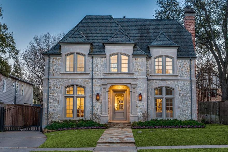 Step inside 4517 N Versailles Ave, the best value in the heart of The French Streets of Highland Park. Situated on an oversized 65 x 150 lot, this 4 bedroom, 5.1 bath, 6190 sqft. clean lined beauty offers the most ideal floor plan with designer finishes. Built by renowned Hawkins-Welwood Homes in 2001, 4517 N Versailles features the perfect blend of elegance and modern luxury. Enter in to spacious formals, 10+ ft tall ceilings, wide hallways, and gleaming hardwoods throughout. The generous sized family room with a fireplace and built-ins overlooks the sparkling pool, spa, and turfed backyard. The stunning, remodeled kitchen is light and bright with top-of-the-line SS appliances and a large walk-in pantry. Butler's pantry with wine storage and crushed ice machine is ideal for hosting. The oversized master suite features a sitting area, large windows overlooking the backyard, and beautiful built-ins. The master bathroom includes separate vanities, his and hers custom closets, a jetted tub, and separate shower. Each bedroom has its own ensuite bathroom, walk-in closet, and custom drapery. The spacious 3rd floor flex room with attached full bath and closet would make a perfect playroom, media room, or home gym. Enjoy the private outdoor oasis with a covered patio, built-in grill, gorgeous pool, spa, and rocky waterfall feature, perfect for entertaining. Guest suite features kitchenette, full bathroom, and closet. The most PRIME Dallas location, walking distance to Bradfield Elementary, Highland Park Village, Flippen Park, and easy access to the tollway!