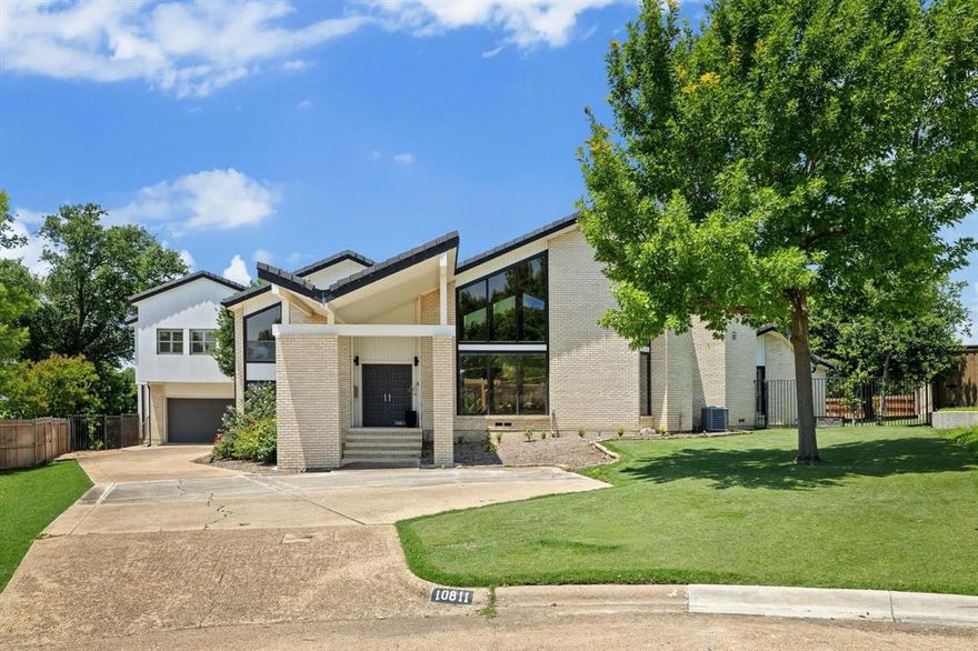 Bold architecture meets refined elegance in this one-of-a-kind Mid-Century Modern retreat in Royal Park Estates, within the prestigious Preston Hollow area. Spanning over 5,000 sq ft on nearly half an acre, this split-level masterpiece is bathed in natural light from dramatic floor-to-ceiling windows. A striking entry leads to expansive living spaces with fresh hardwood floors and bold geometry throughout.

Designed for entertaining, the chef’s kitchen features granite counters, sleek cabinetry, double ovens, gas cooktop, and generous prep space — all overlooking the lush backyard. The spa-inspired primary suite is a true sanctuary, highlighted by a freestanding soaking tub framed by oversized windows, walk-in shower, and clean contemporary finishes.

Step outside to your private oasis: an expansive patio with electric louvres, mature landscaping, a sparkling diving pool, and a fenced garden with eight raised beds, fruit trees, and berry bushes. The lot offers rare privacy, functionality, and beauty — all just steps from the Northaven Trail.

Inside, the home offers exceptional storage with five dedicated storage rooms and oversized closets in every bedroom.

Offered at $2,275,000 — a rare architectural gem combining timeless design, space, and serenity in one of Dallas’s most coveted neighborhoods.
Bonus: $50,000 credit toward kitchen upgrades!